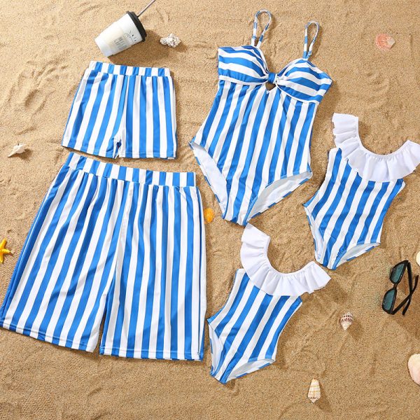 Parent-Child Blue and White Bikini Set on the Beach